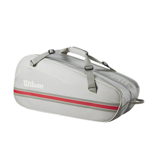 Gray tennis bag with red stripe and Wilson logo on a white background